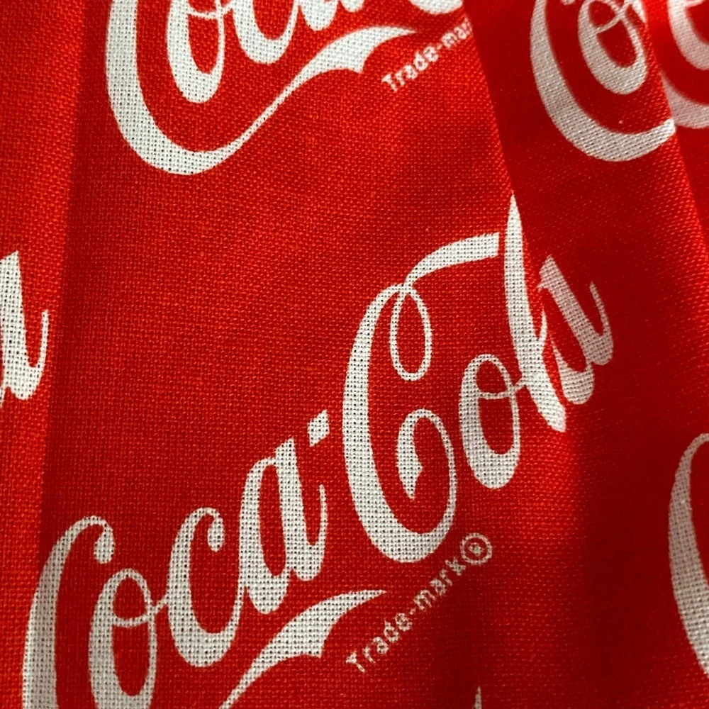 Handmade wall hanging grocery bags organizer and pantry with Coca Cola logo.